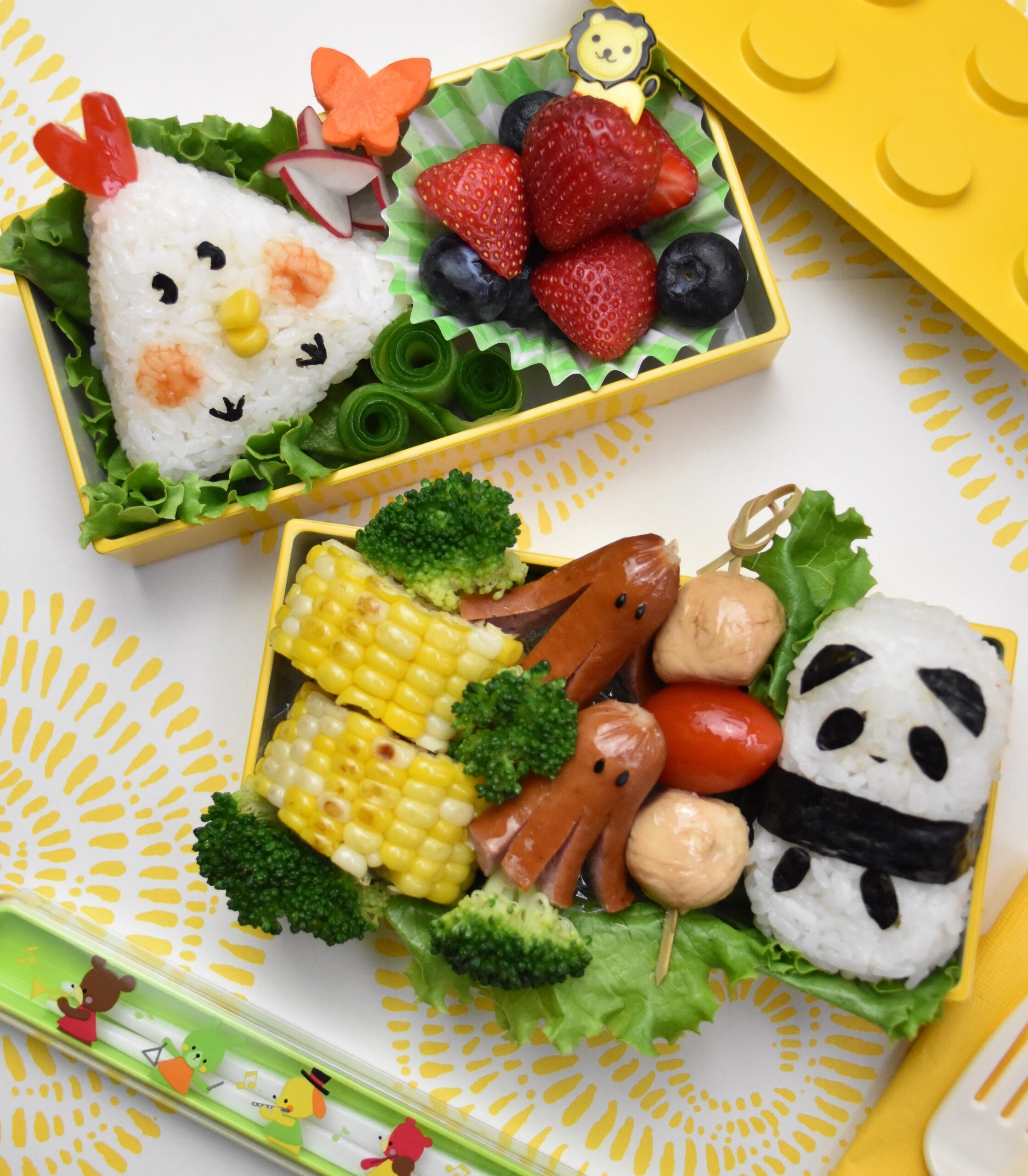 Bento boxes with animals crafted from different foods