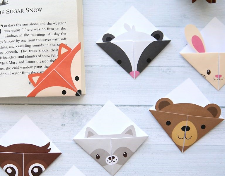 Origami bookmarks in the shape of a fox, skunk, rabbit, bear, raccoon, and owl.